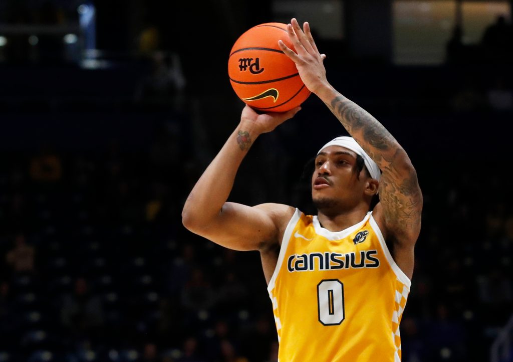 Dec 9, 2023; Pittsburgh, Pennsylvania, USA; Canisius Golden Griffins guard Tre Dinkins (0) shoots against the Pittsburgh Panthers during the second half at the Petersen Events Center. Pittsburgh won 82-71. Mandatory Credit: Charles LeClaire-Imagn Images