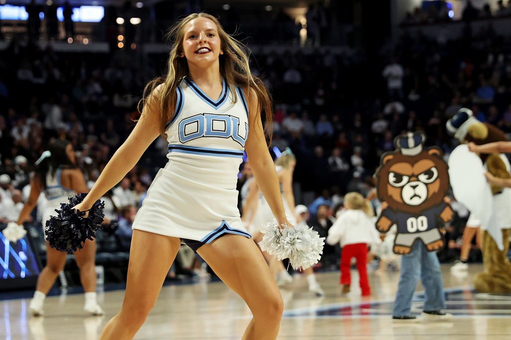 Dec 9, 2023; Norfolk, Virginia, USA; An Old Dominion Monarchs cheerleader dances during the game between the Old Dominion Monarchs and the James Madison Dukes at Chartway Arena at the Ted Constant Convocation Center. Mandatory Credit: Peter Casey-Imagn Images