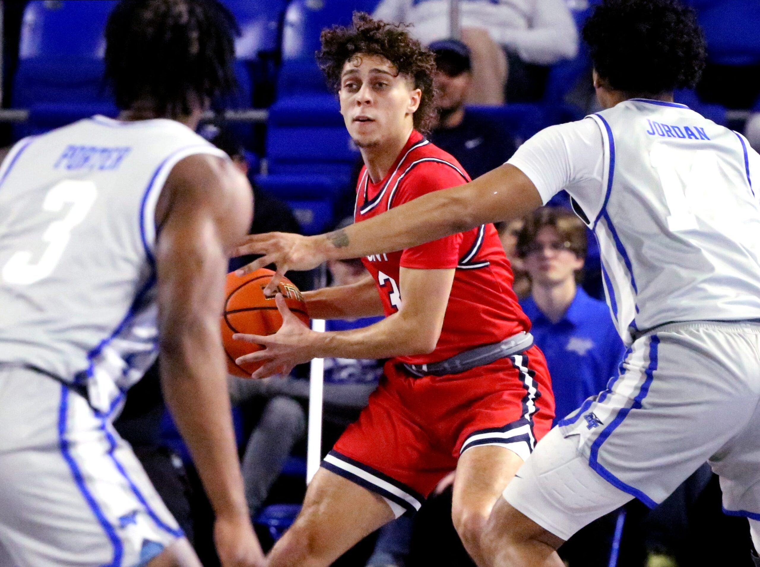 Belmont guard Keishawn Davidson (3) looks to pass the ball as he brings the ball up the court and Middle Tennessee guard Jestin Porter (3) and Middle Tennessee guard Jalen Jordan (14) guard him during the men   s basketball game on Saturday, Dec. 9, 2023, at MTSU..