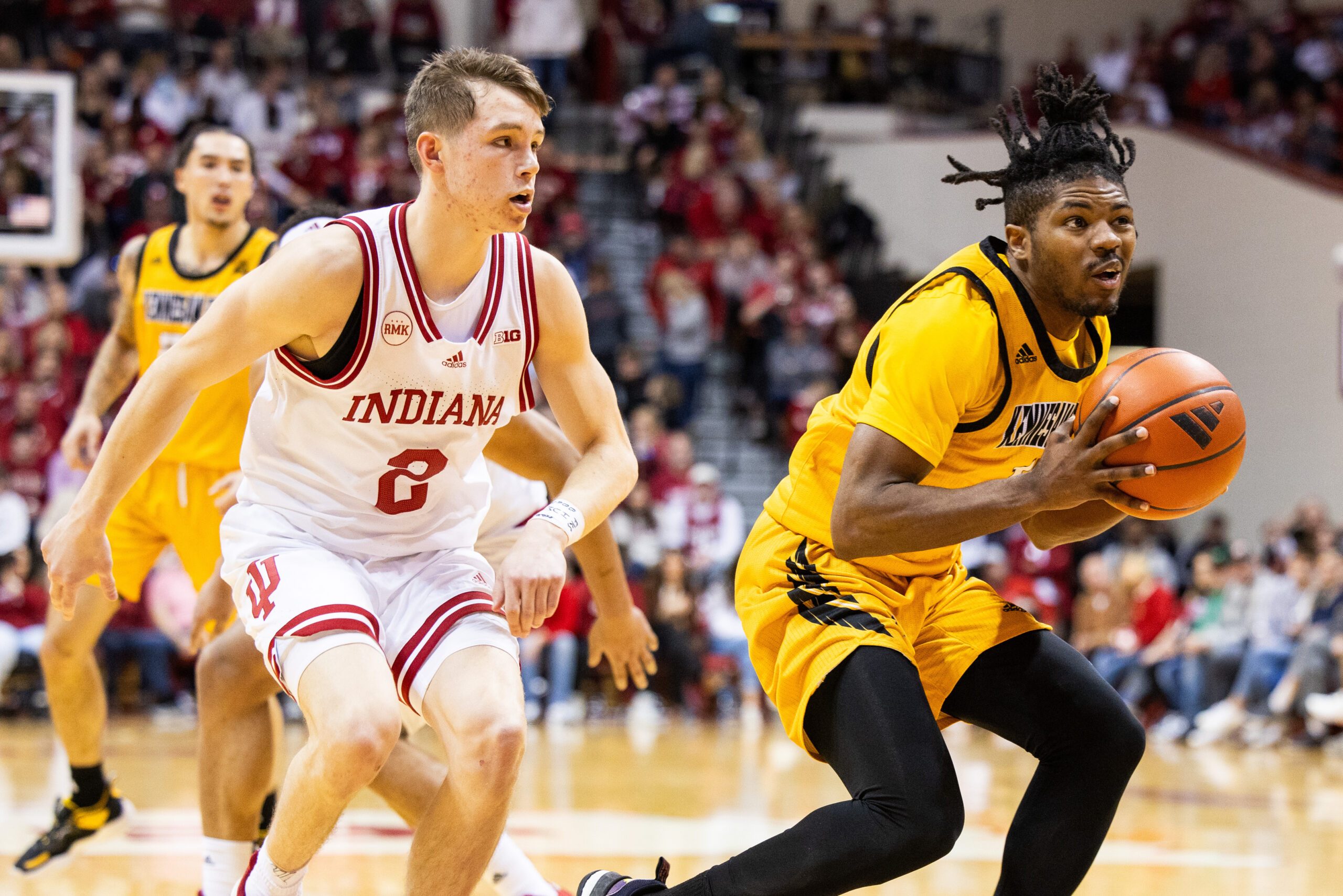 Dec 29, 2023; Bloomington, Indiana, USA; Kennesaw State Owls guard Terrell Burden (1) shoots the ball while Indiana Hoosiers guard Gabe Cupps (2) defends in the second half at Simon Skjodt Assembly Hall. Mandatory Credit: Trevor Ruszkowski-Imagn Images
