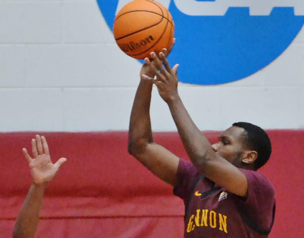Gannon University junior Derrick Anderson, right, shoots near Edinboro University junior Bernie Blunt during a men's basketball game in Edinboro on Jan. 10, 2024.