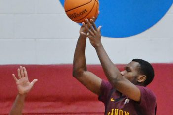 Gannon University junior Derrick Anderson, right, shoots near Edinboro University junior Bernie Blunt during a men's basketball game in Edinboro on Jan. 10, 2024.
