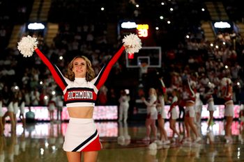 Jan 27, 2024; Richmond, Virginia, USA; A Richmond Spiders cheerleader looks on from the court prior to the Spiders' game against the Dayton Flyers during the first half at the Robins Center. Mandatory Credit: Amber Searls-Imagn Images