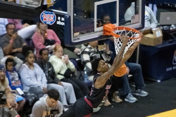 Izaiyah Nelson (35) dunks during the Arkansas State vs James Madison basketball game in the finals of the Sun Belt Conference Men's Basketball Championship at the Pensacola Bay Center in Pensacola, Florida, on Monday, March 11, 2024. The Dukes defeated the Red Wolves 91 - 71.