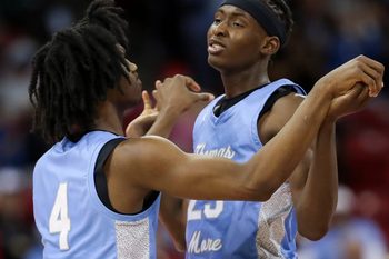 St. Thomas More High School's Amari McCottry (4) and Sekou Konneh (25) embrace during a timeout against Lakeside Lutheran High School in the Division 3 state championship game during the WIAA state boys basketball tournament on Saturday, March 16, 2024 at the Kohl Center in Madison, Wis. St. Thomas More won the game, 65-54.
Tork Mason/USA TODAY NETWORK-Wisconsin