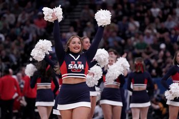 Mar 21, 2024; Salt Lake City, UT, USA; Samford Bulldogs cheerleaders during the first half in the first round of the 2024 NCAA Tournament against the Kansas Jayhawks at Vivint Smart Home Arena-Delta Center. Mandatory Credit: Gabriel Mayberry-Imagn Images