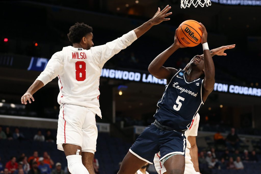 Mar 22, 2024; Memphis, TN, USA; Longwood Lancers guard Johnathan Massie (5) shoots as Houston Cougars guard Mylik Wilson (8) defends during the second half in the NCAA Tournament First Round at FedExForum. Mandatory Credit: Petre Thomas-Imagn Images