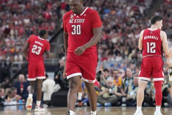 North Carolina State Wolfpack forward DJ Burns Jr. (30) walks back down court during the NCAA MenÃ¢â‚¬â„¢s Basketball Tournament Final Four game against the Purdue Boilermakers, Saturday, April 6, 2024, at State Farm Stadium in Glendale, Ariz.