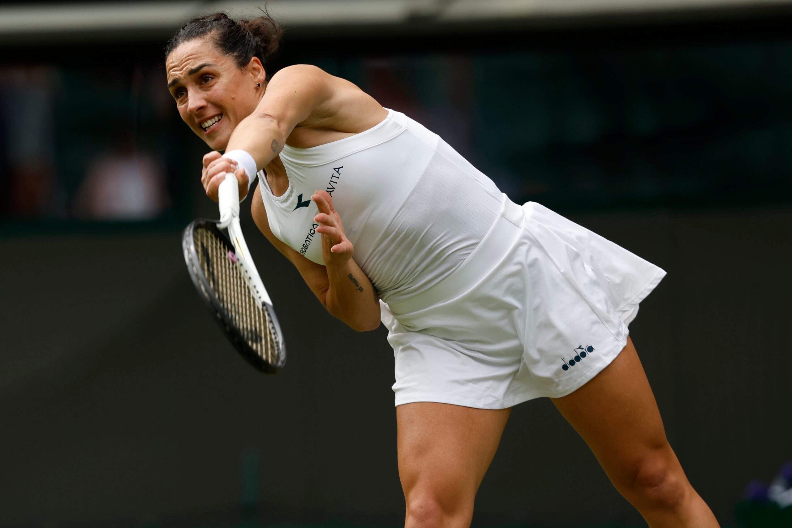Jul 1, 2024; London, United Kingdom, Martina Trevisan (ITA) serves against Madison Keys (USA (not pictured) in a ladies singles match on day 1 in The Championships Wimbledon at the All England Lawn Tennis and Croquet Club. Mandatory Credit: Geoff Burke-Imagn Images