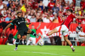 Aug 3, 2024; Columbia, South Carolina, USA;  Liverpool forward Mohamed Salah (11) and Manchester United defender Harry Amass (41) battle for the ball at Williams-Brice Stadium. Mandatory Credit: Jeff Blake-Imagn Images