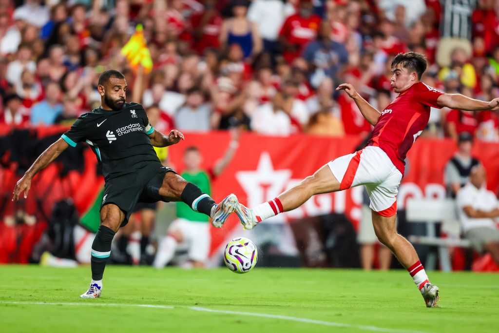Aug 3, 2024; Columbia, South Carolina, USA; Liverpool forward Mohamed Salah (11) and Manchester United defender Harry Amass (41) battle for the ball at Williams-Brice Stadium. Mandatory Credit: Jeff Blake-Imagn Images