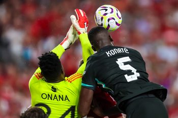 Aug 3, 2024; Columbia, South Carolina, USA;  Manchester United goalkeeper André Onana (24) and Liverpool defender Ibrahima Konaté (5) battle for the ball at Williams-Brice Stadium. Mandatory Credit: Jeff Blake-Imagn Images