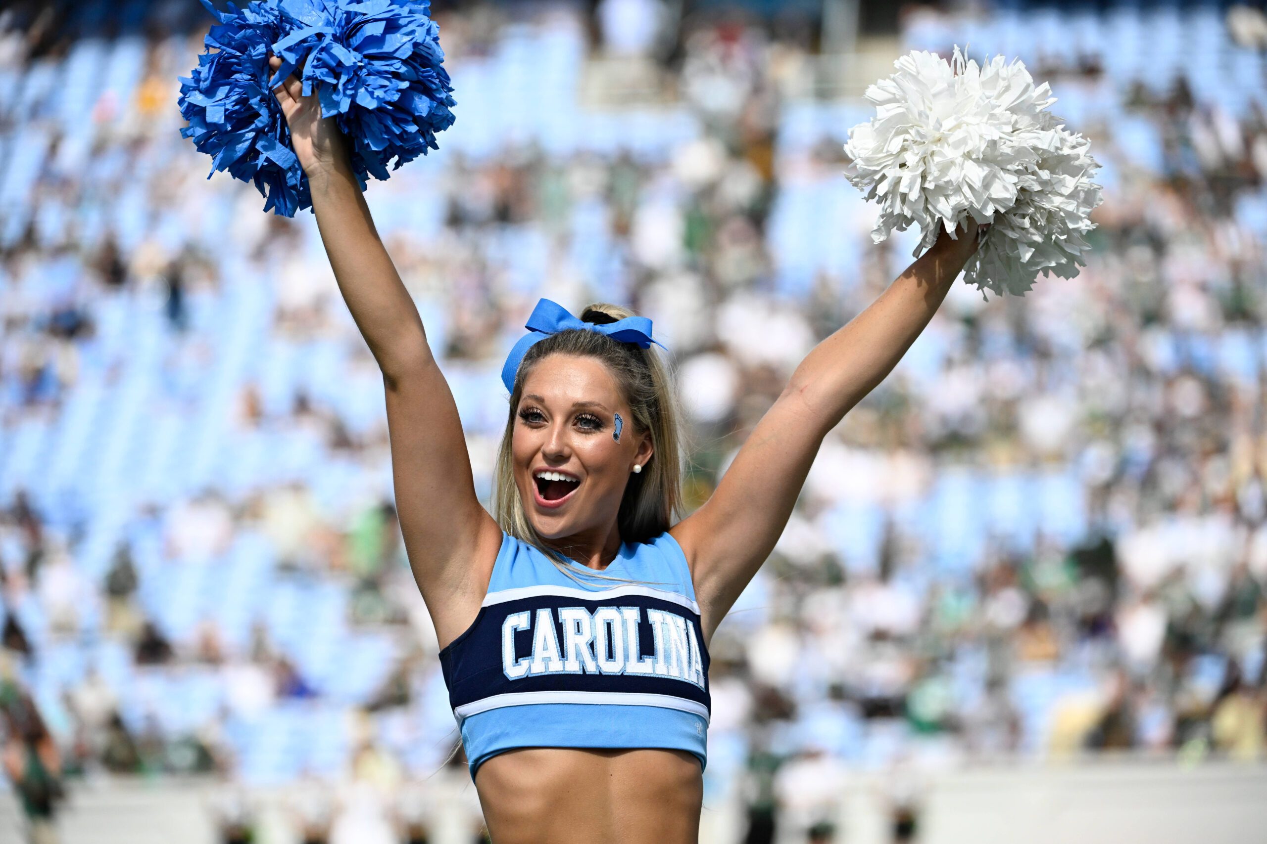 Sep 7, 2024; Chapel Hill, North Carolina, USA;  North Carolina Tar Heels cheerleader performs in the 1st quarter at Kenan Memorial Stadium. Mandatory Credit: Bob Donnan-Imagn Images