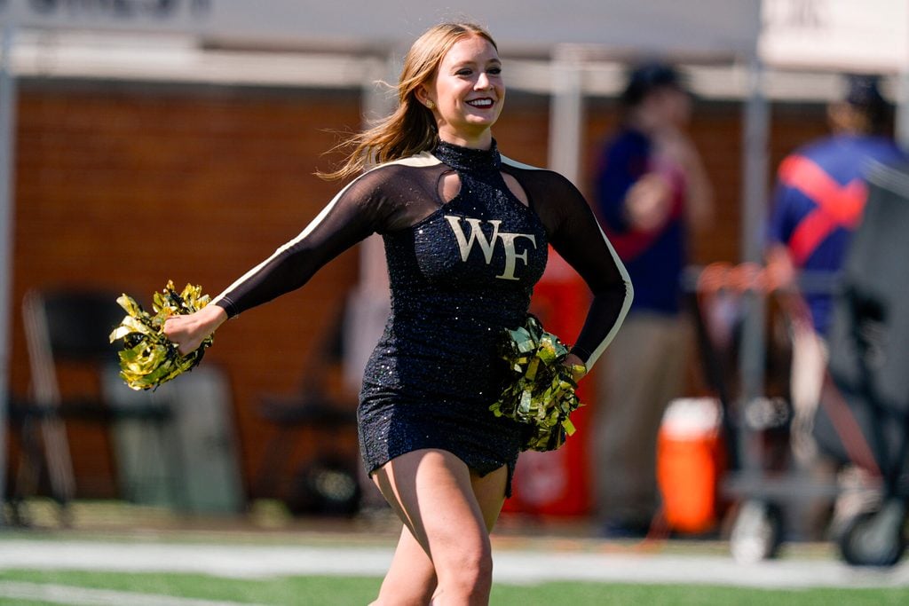 Oct 12, 2024; Winston-Salem, North Carolina, USA; Wake Forest Demon Deacons cheerleader during the first half against the Clemson Tigers at Allegacy Federal Credit Union Stadium. Mandatory Credit: Jim Dedmon-Imagn Images