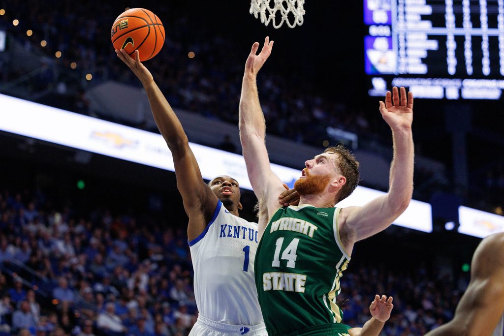 Nov 4, 2024; Lexington, Kentucky, USA; Kentucky Wildcats guard Lamont Butler (1) goes to the basket against Wright State Raiders forward Brandon Noel (14) during the second half at Rupp Arena at Central Bank Center. Mandatory Credit: Jordan Prather-Imagn Images