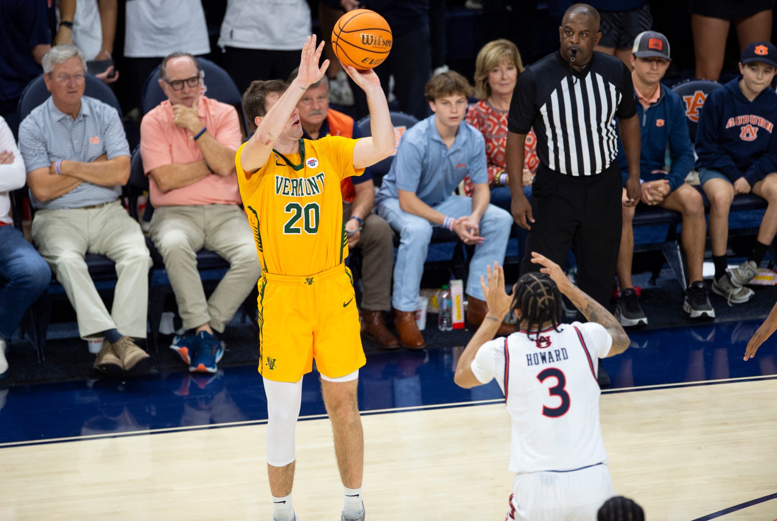 Vermont Catamounts guard TJ Long (20) takes a jump shot as Auburn Tigers take on Vermont Catamounts at Neville Arena in Auburn, Ala., on Wednesday, Nov. 6, 2024. Auburn Tigers defeated Vermont Catamounts 94-43.