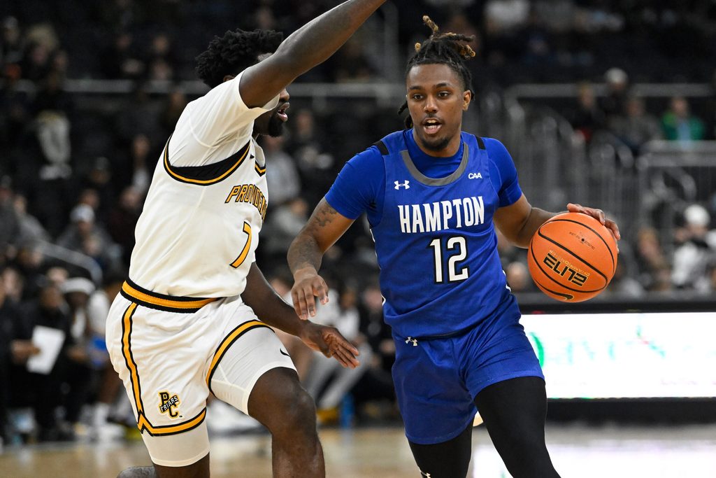 Nov 12, 2024; Providence, Rhode Island, USA; Hampton Pirates guard Tyler Rice (12) drives against Providence Friars guard Bensley Joseph (7) during the second half at Amica Mutual Pavilion. Mandatory Credit: Eric Canha-Imagn Images