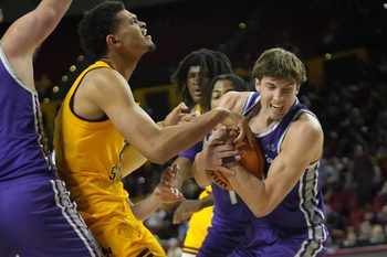 St. Thomas guard Nolan Minessale (4) strips the ball from Arizona State forward Basheer Jihad (8) during the first half at Desert Financial Arena on Sunday, Nov. 17, 2024.