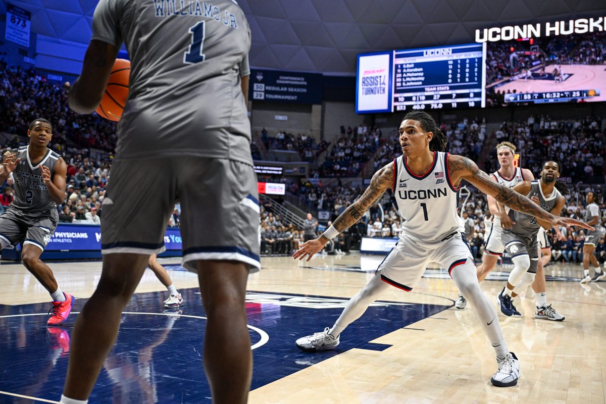 Nov 19, 2024; Storrs, Connecticut, USA; Connecticut Huskies guard Solo Ball (1) defends the inbound pass by Texas A&M Commerce guard Scooter Williams Jr. (1) during the second half at Harry A. Gampel Pavilion. Mandatory Credit: Mark Smith-Imagn Images