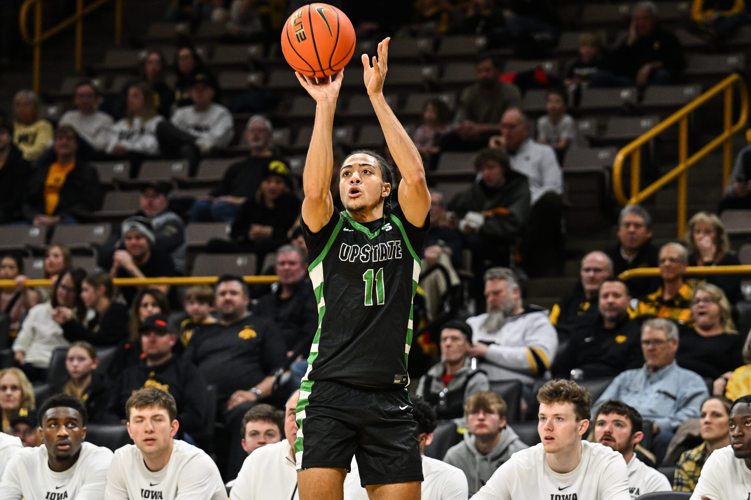 Nov 26, 2024; Iowa City, Iowa, USA; USC Upstate Spartans guard Karmani Gregory (11) shoots the ball against the Iowa Hawkeyes during the first half at Carver-Hawkeye Arena. Mandatory Credit: Jeffrey Becker-Imagn Images