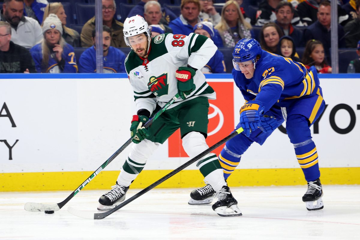 Nov 27, 2024; Buffalo, New York, USA; Buffalo Sabres center Tage Thompson (72) tries to block a pass by Minnesota Wild center Frederick Gaudreau (89) during the third period at KeyBank Center. Mandatory Credit: Timothy T. Ludwig-Imagn Images