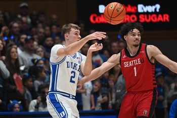 Nov 29, 2024; Durham, North Carolina, USA;  Duke Blue Devils forward Cooper Flagg (2) throws a pass in front of Seattle Redhawks guard Maleek Arington (1) during the first half at Cameron Indoor Stadium. Mandatory Credit: Rob Kinnan-Imagn Images