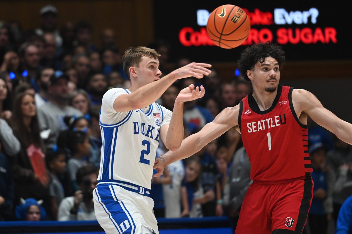 Nov 29, 2024; Durham, North Carolina, USA; Duke Blue Devils forward Cooper Flagg (2) throws a pass in front of Seattle Redhawks guard Maleek Arington (1) during the first half at Cameron Indoor Stadium. Mandatory Credit: Rob Kinnan-Imagn Images
