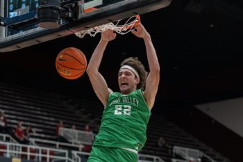 Dec 3, 2024; Stanford, California, USA; Utah Valley Wolverines forward Carter Welling (22) dunks the basketball against the Stanford Cardinal during the second half at Maples Pavilion. Mandatory Credit: Neville E. Guard-Imagn Images