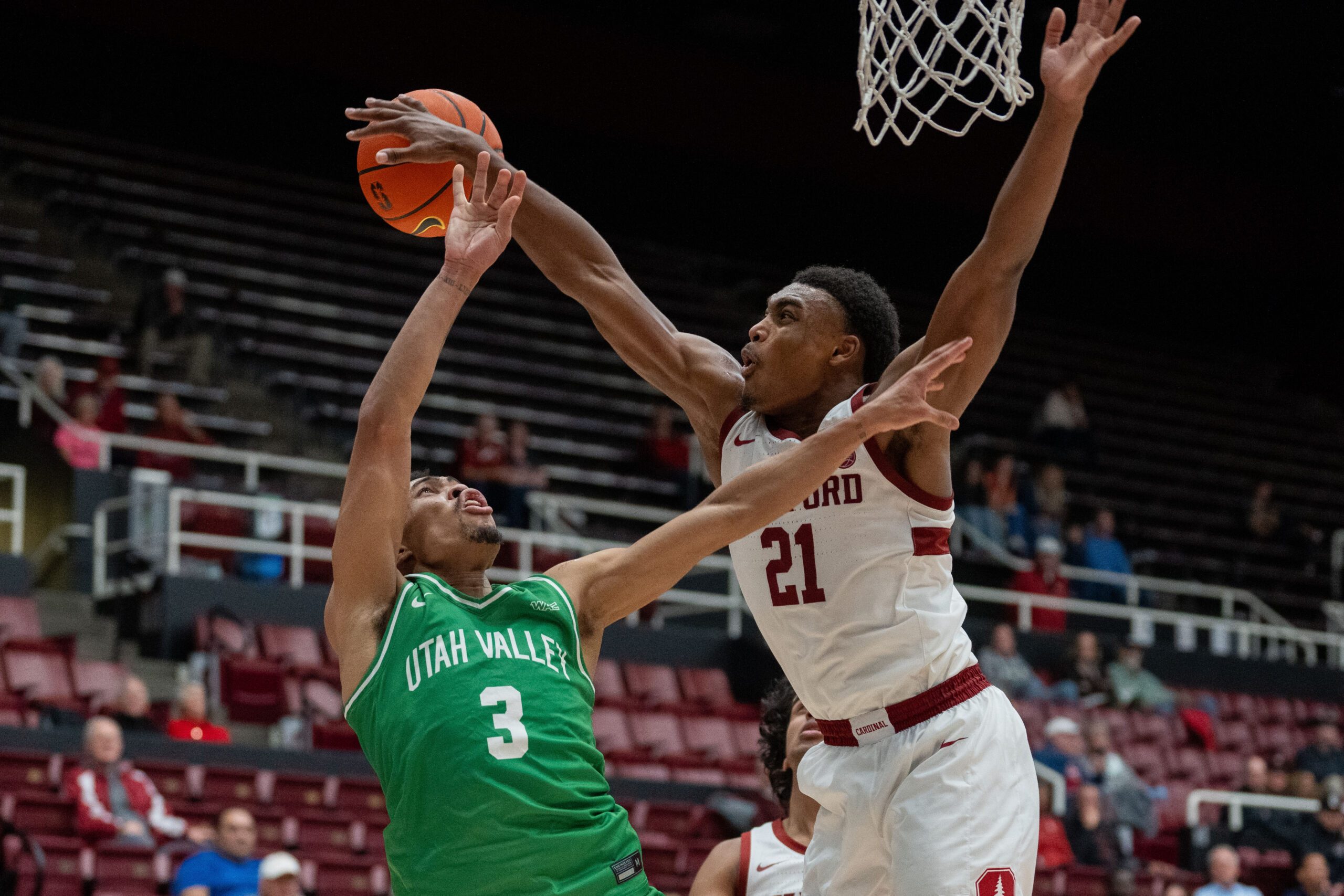 Dec 3, 2024; Stanford, California, USA; Stanford Cardinal guard Jaylen Blakes (21) is called for a foul against Utah Valley Wolverines guard Kylin Green (3) during the second half at Maples Pavilion. Mandatory Credit: Neville E. Guard-Imagn Images