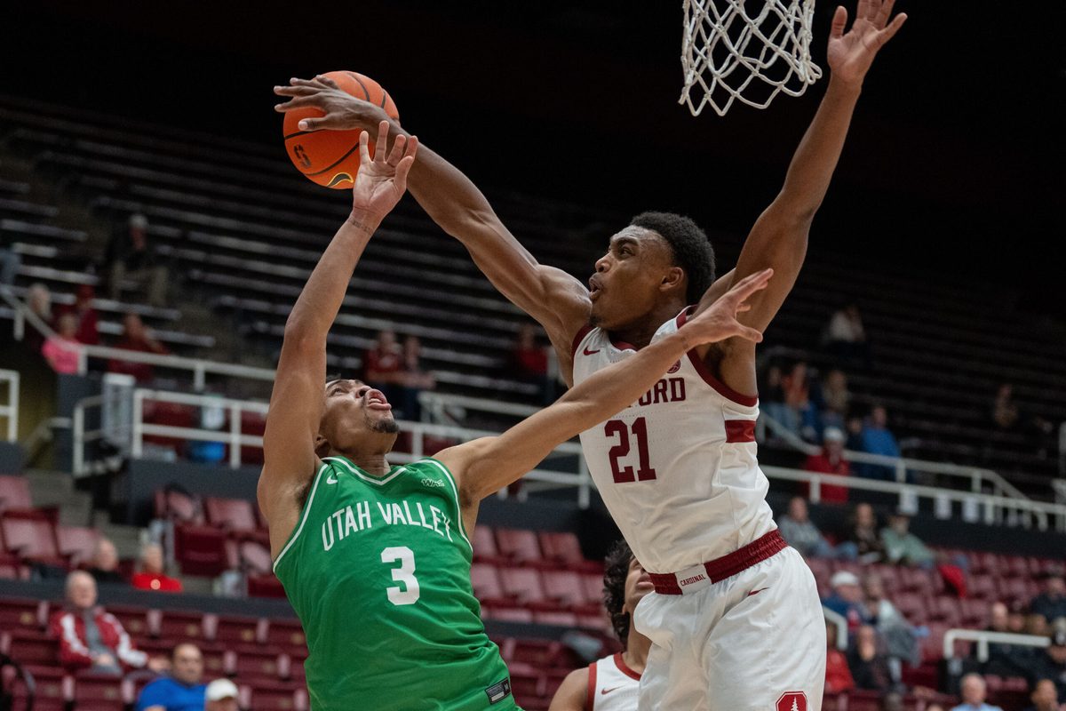 Dec 3, 2024; Stanford, California, USA; Stanford Cardinal guard Jaylen Blakes (21) is called for a foul against Utah Valley Wolverines guard Kylin Green (3) during the second half at Maples Pavilion. Mandatory Credit: Neville E. Guard-Imagn Images