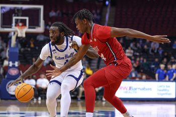 Dec 4, 2024; Newark, New Jersey, USA; Seton Hall Pirates forward Prince Aligbe (4) is guarded by NJIT Highlanders guard Ari Fulton (24) during the first half at Prudential Center. Mandatory Credit: Vincent Carchietta-Imagn Images