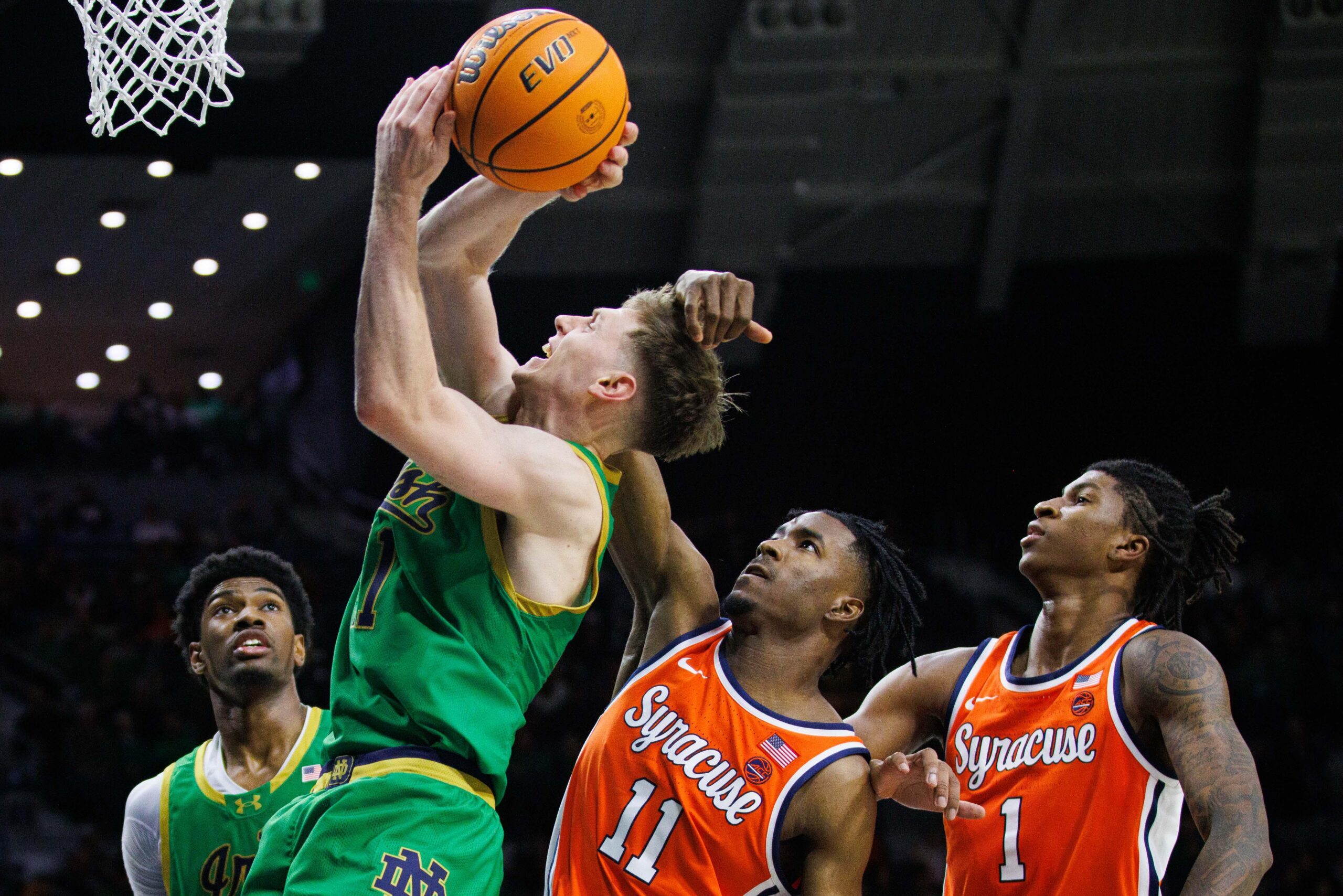 Syracuse guard Chance Westry (11) fouls Notre Dame guard Matt Allocco (41) during a NCAA men's basketball game at Purcell Pavilion on Saturday, Dec. 7, 2024, in South Bend.