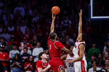 Dec 7, 2024; Tucson, Arizona, USA; Southern Utah Thunderbirds Jamir Simpson (3) shoots the ball while Arizona Wildcats guard Carter Bryant (9) attempts to block him during the second half at McKale Center. Mandatory Credit: Aryanna Frank-Imagn Images