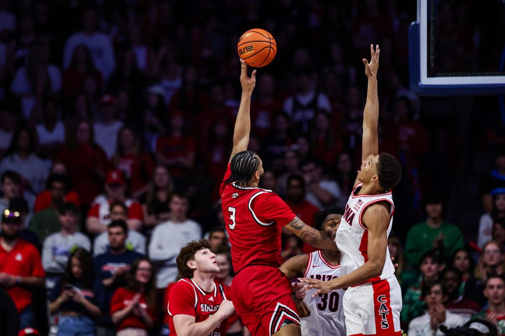 Dec 7, 2024; Tucson, Arizona, USA; Southern Utah Thunderbirds Jamir Simpson (3) shoots the ball while Arizona Wildcats guard Carter Bryant (9) attempts to block him during the second half at McKale Center. Mandatory Credit: Aryanna Frank-Imagn Images