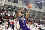 Dec 7, 2024; Norman, Oklahoma, USA; Alcorn State Braves forward Djahi Binet (15) goes to the basket as Oklahoma Sooners forward Jalon Moore (14) defends during the second half at Lloyd Noble Center. Mandatory Credit: Alonzo Adams-Imagn Images