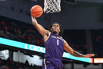 Dec 10, 2024; Syracuse, New York, USA; Albany Great Danes guard Amar'e Marshall (1) dunks the ball against the Syracuse Orange in the first half at the JMA Wireless Dome. Mandatory Credit: Mark Konezny-Imagn Images