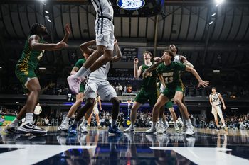 Dec 10, 2024; Indianapolis, Indiana, USA; Butler Bulldogs forward Augusto Cassia (0) scores during the second half against the North Dakota State Bison at Hinkle Fieldhouse. Mandatory Credit: Robert Goddin-Imagn Images