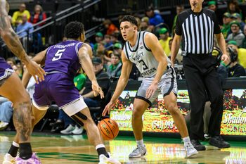Dec 15, 2024; Eugene, Oregon, USA; Oregon Ducks guard Jackson Shelstad (3) dribbles the ball against Stephen F. Austin Lumberjacks guard Keon Thompson (5) during the first half at Matthew Knight Arena. Mandatory Credit: Craig Strobeck-Imagn Images