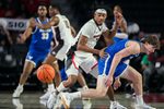 Dec 19, 2024; Athens, Georgia, USA; Georgia Bulldogs guard Tyrin Lawrence (7) steals the ball from Buffalo Bulls guard Ryan Sabol (2) at Stegeman Coliseum. Mandatory Credit: Dale Zanine-Imagn Images