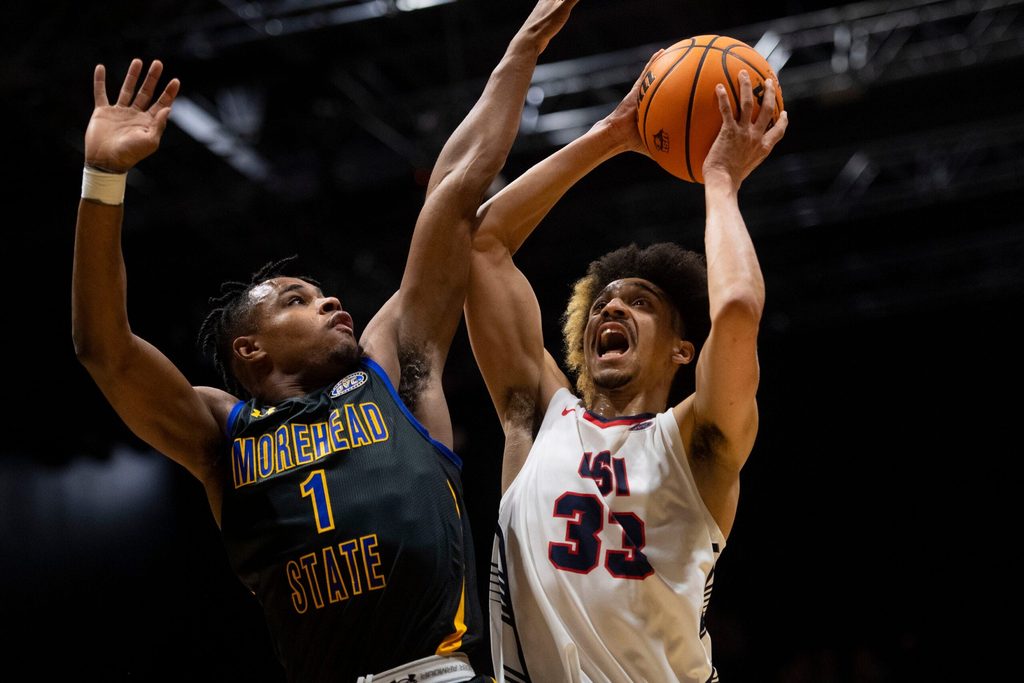 Southern Indiana’s Jeremiah Hernandez (33) is fouled by Morehead State’s Jerone Morton (1) as the University of Southern Indiana Screaming Eagles play the Morehead State Eagles at Screaming Eagles Arena in Evansville, Ind., Saturday, Jan. 20, 2024.