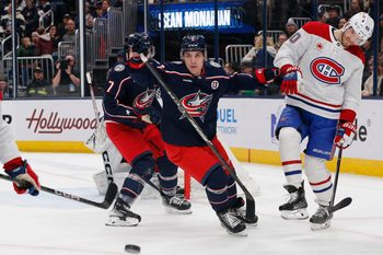 Dec 23, 2024; Columbus, Ohio, USA; Columbus Blue Jackets defenseman Denton Mateychuk (5) checks Montreal Canadiens right wing Joel Armia (40) during the first period at Nationwide Arena. Mandatory Credit: Russell LaBounty-Imagn Images
