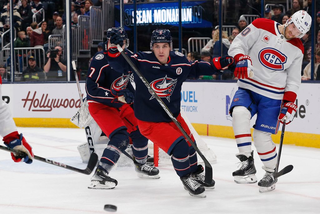 Dec 23, 2024; Columbus, Ohio, USA; Columbus Blue Jackets defenseman Denton Mateychuk (5) checks Montreal Canadiens right wing Joel Armia (40) during the first period at Nationwide Arena. Mandatory Credit: Russell LaBounty-Imagn Images