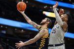 Dec 28, 2024; Washington, District of Columbia, USA; Coppin State Eagles forward Khali Horton (4) shoots the ball against Georgetown Hoyas forward Thomas Sorber (35) during the second half at Capital One Arena. Mandatory Credit: Daniel Kucin Jr.-Imagn Images