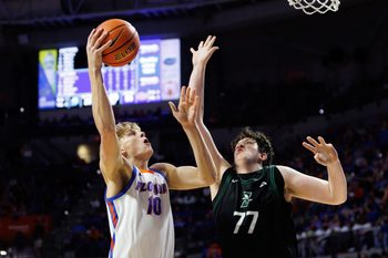 Dec 29, 2024; Gainesville, Florida, USA; Florida Gators forward Thomas Haugh (10) shoots over Stetson Hatters forward Stefano Alesso (77) during the second half at Exactech Arena at the Stephen C. O'Connell Center. Mandatory Credit: Matt Pendleton-Imagn Images