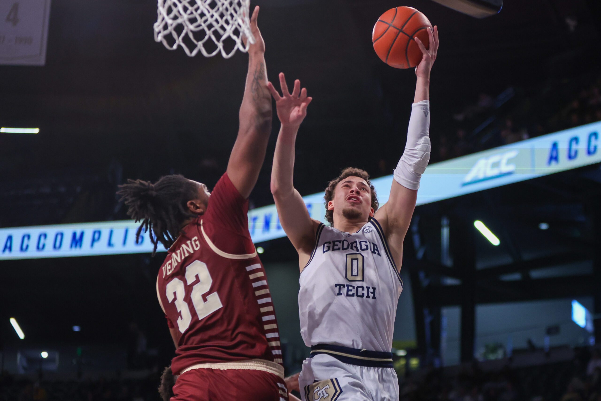 Jan 4, 2025; Atlanta, Georgia, USA; Georgia Tech Yellow Jackets guard Lance Terry (0) shoots past Boston College Eagles forward Chad Venning (32) in the second half at McCamish Pavilion. Mandatory Credit: Brett Davis-Imagn Images