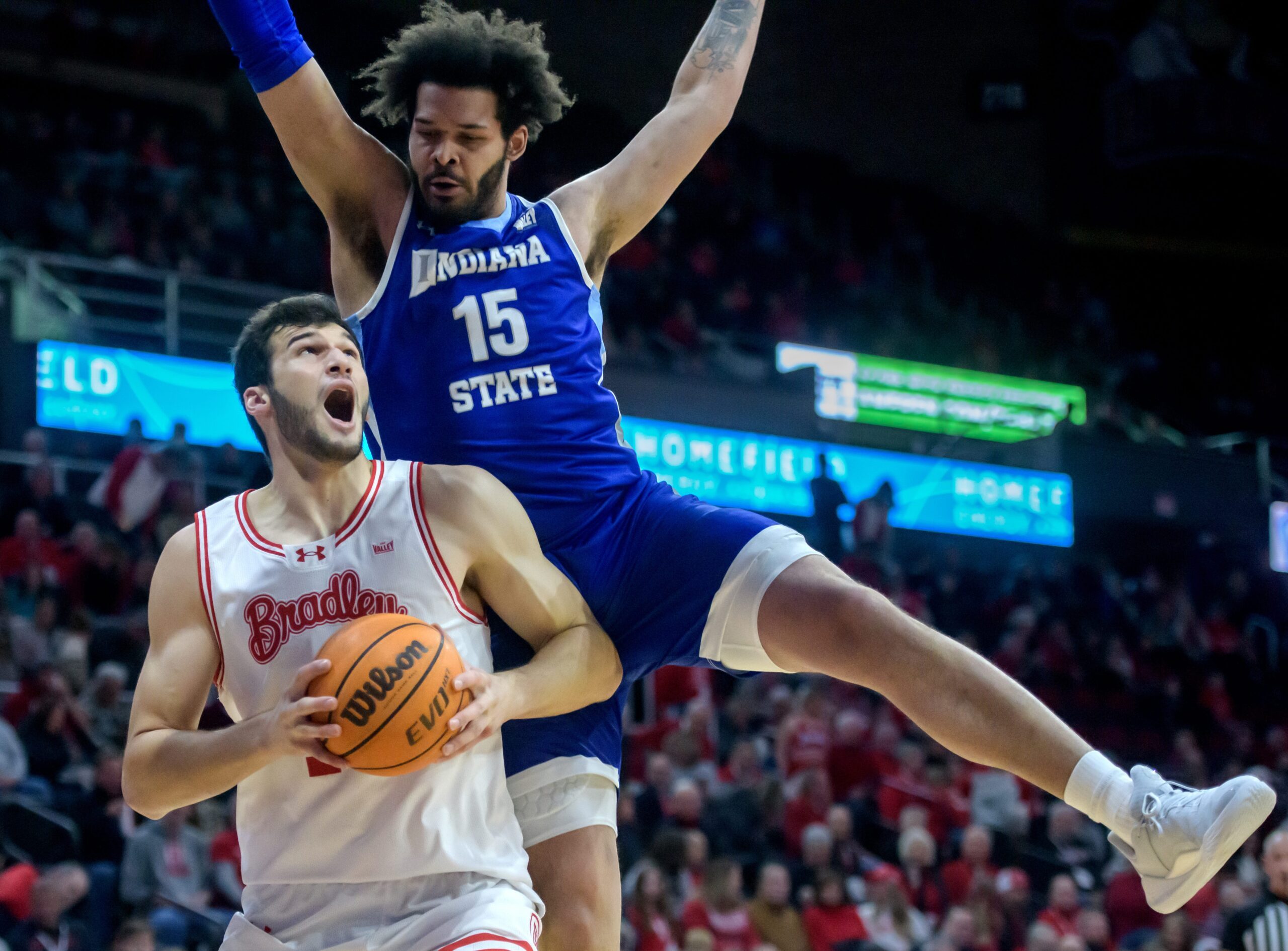 Bradley’s Ahmet Jonovic looks for a shot as Indiana State’s Markus Harding defends in the first half of their MVC college basketball game Wednesday, Jan. 15, 2025 at Carver Arena in Peoria. The Braves routed the Sycamores 118-65.