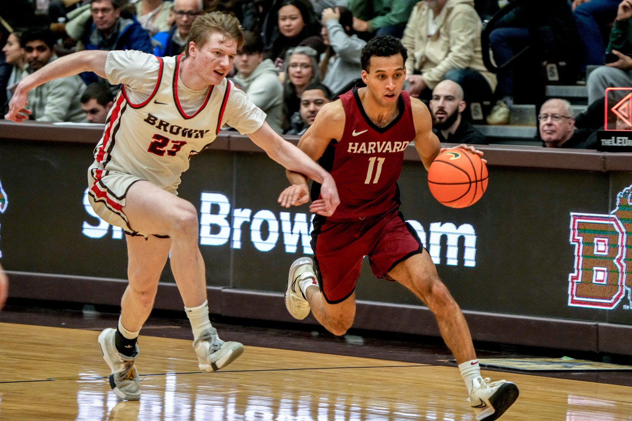 David Rochester chases down Harvard's Evan Nelson