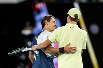 Jan 22, 2025; Melbourne, Victoria, Australia; Jannik Sinner of Italy and Alex de Minaur of Australia shake hands after their match in the quarterfinals of the men's singles at the 2025 Australian Open at Melbourne Park. Mandatory Credit: Mike Frey-Imagn Images