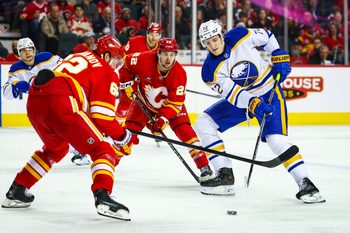 Jan 23, 2025; Calgary, Alberta, CAN; Buffalo Sabres center Tage Thompson (72) controls the puck against the Calgary Flames during the third period at Scotiabank Saddledome. Mandatory Credit: Sergei Belski-Imagn Images