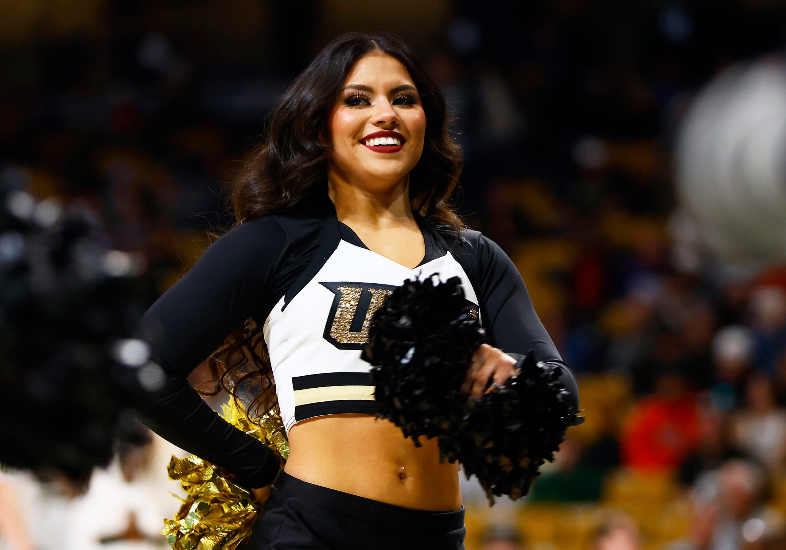 Jan 25, 2025; Orlando, Florida, USA;  A Central Florida Knights cheerleader performs during a game against the Texas Christian Horned Frogs at Addition Financial Arena. Mandatory Credit: Russell Lansford-Imagn Images